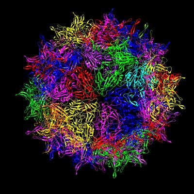 A multicolored sphere made up of a dense network of colored ribbons against a black background.